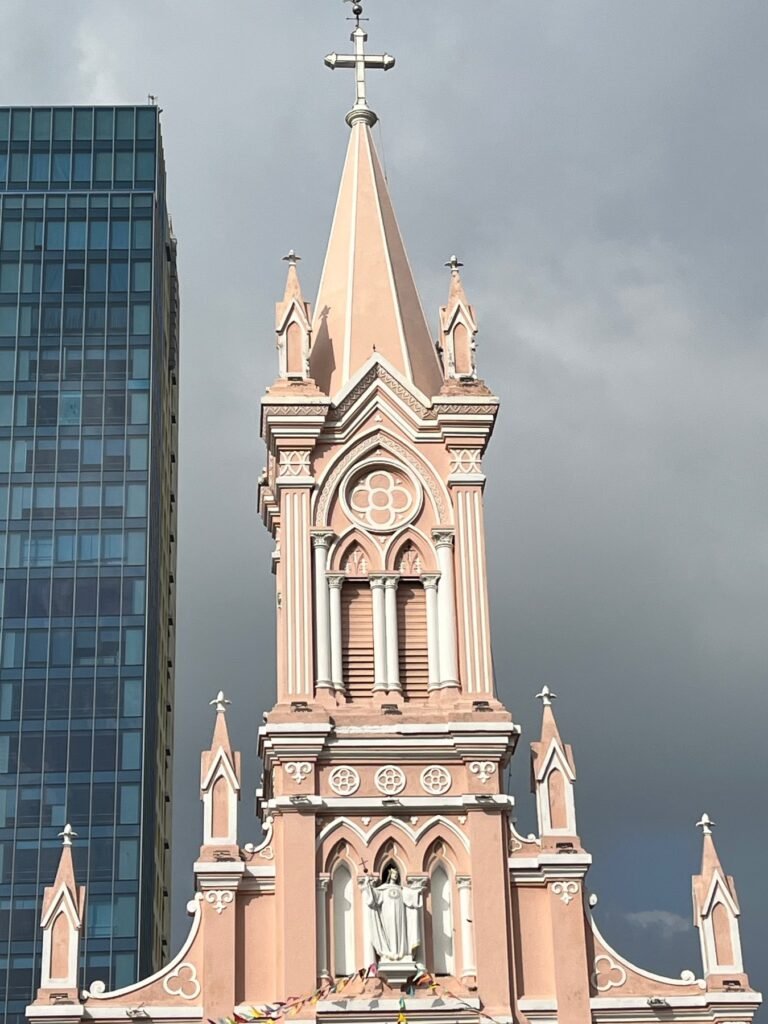 The pink facade and bell tower of Da Nang Cathedral