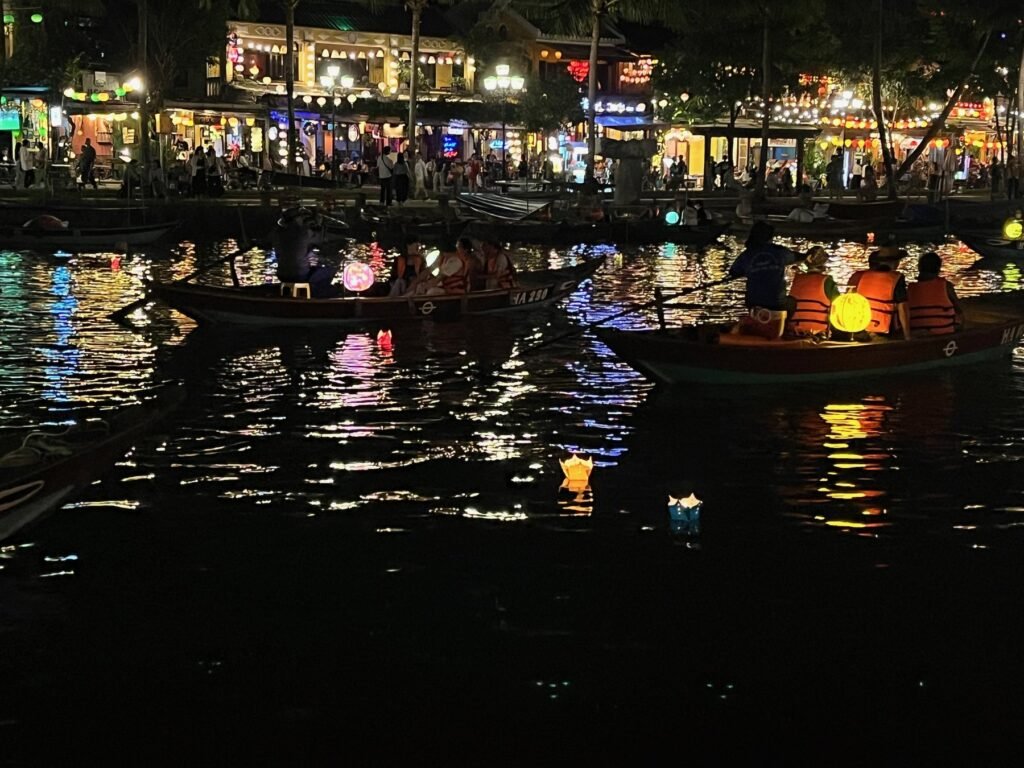 Lantern boats glowing on the Hoai River in Hoi An