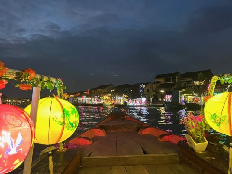 Colorful lanterns reflected on the Hoai River in Hoi An at night